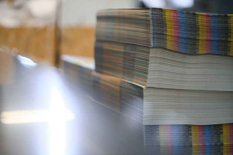 paper pile in a finishing, folder station in an offset printer